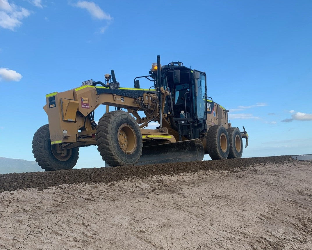 Motor grader undertaking earthworks on a civil construction project